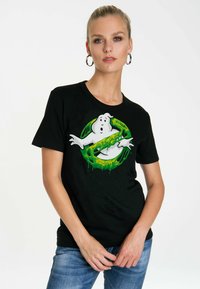 Black cotton t-shirt featuring a Ghostbusters graphic with a green logo and a cartoon ghost. Short sleeves and soft texture.