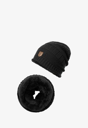 Black knit beanie with textured patterns and a leather patch, paired with a soft, black fleece neck warmer in a circular shape.