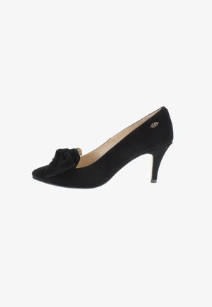 Black suede mid-heel pump with pointed toe, decorative bow on front, and small gold emblem near heel.