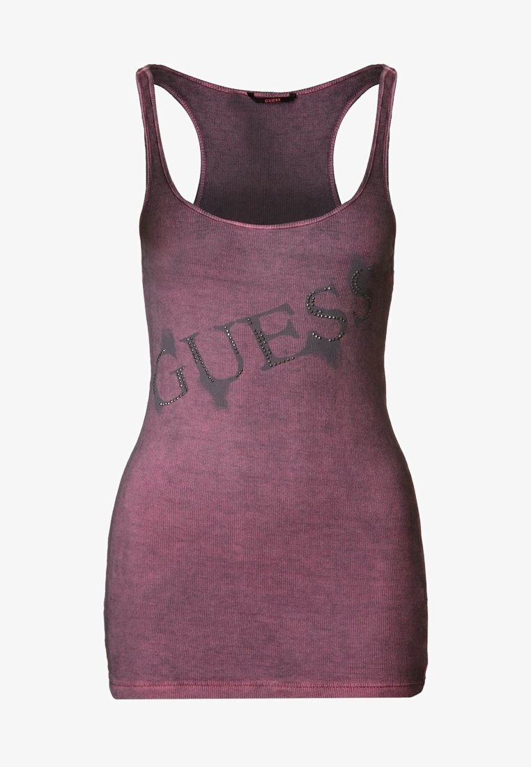 Purple ribbed tank top featuring a distressed "GUESS" logo with rhinestone accents. Designed with wide shoulder straps and a fitted shape.