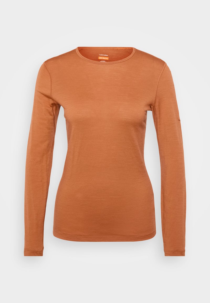 Langarmshirt in verbranntem Orange, aus weichem Material. Hat einen runden Ausschnitt und einen abgerundeten Saum, mit minimalen Nähten und ohne Muster.