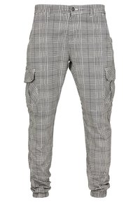 Cargo-Hosen im schwarz-weißen Karomuster, aus gewebtem Stoff mit Seitentaschen und schmal zulaufenden Bündchen. Mit Knopfverschluss und Gürtelschlaufen.