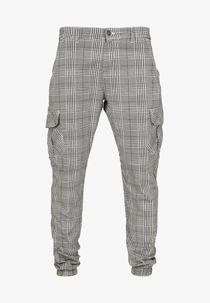 Cargo-Hosen im schwarz-weißen Karomuster, aus gewebtem Stoff mit Seitentaschen und schmal zulaufenden Bündchen. Mit Knopfverschluss und Gürtelschlaufen.