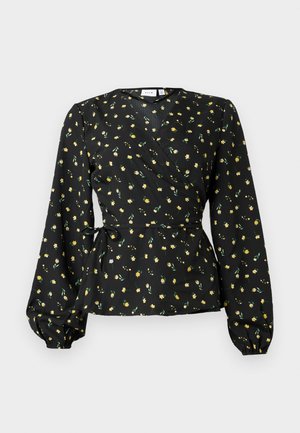 Blusa negra con mangas largas abullonadas, pequeño estampado floral amarillo y detalle de lazo en la cintura.