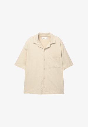 Beige Kurzarmhemd mit lockerer Passform, strukturiertem Stoff, Knopfleiste, Kragen und einer einzelnen Brusttasche.