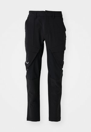 Schwarze Outdoor-Hosen aus wetterbeständigem Material. Mit Reißverschluss-Taschen, verstärkten Kniepartien und einer figurschmeichelnden Silhouette.