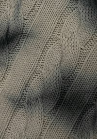 Cable-knit fabric in a gradient of light beige to dark gray. Features raised braids and a soft, textured surface.