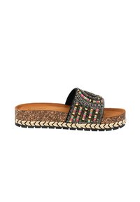 Sandale à glissière avec une semelle en liège, une sangle tissée noire ornée de perles multicolores et un bord texturé tressé. Semelle extérieure en caoutchouc plate.