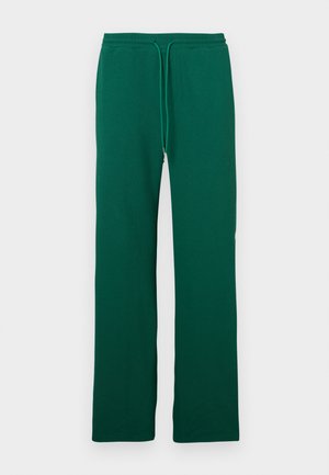 Tummanvihreät collegehousut joustavalla vyötäröhihnalla ja kiristysnarulla, suora lahje, esiteltynä yksinkertaisella valkoisella taustalla.