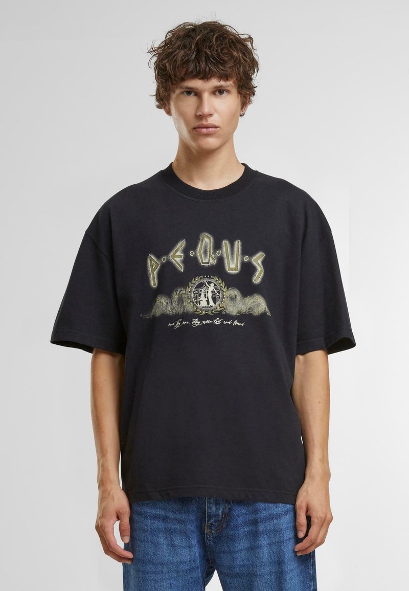 Zwart oversized t-shirt met korte mouwen, voorzien van grafische tekst en illustratie in groen en wit. Gemaakt van katoen met een zachte textuur.