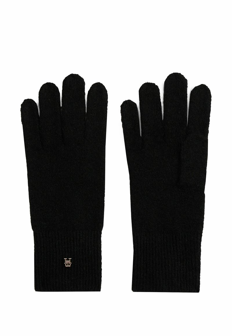 Knitted black gloves with ribbed cuffs, comprised of a soft fabric. Features include a folded cuff and small logo detail on one glove.