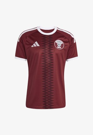 Maglia da football color bordeaux con dettagli bianchi, caratterizzata da un motivo a chevron al centro e un logo sul petto. Realizzata in tessuto traspirante.