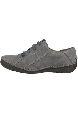 Grey leather shoe with a low-profile design, textured surface, subtle stitching, and dark grey laces. Features a rubber sole for traction.