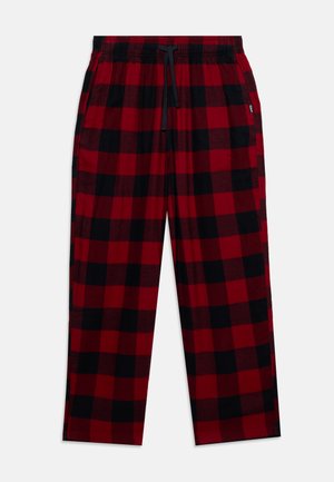 Pantalon de détente à carreaux rouges et noirs, avec une ceinture élastique noire, un cordon de serrage et des poches latérales.
