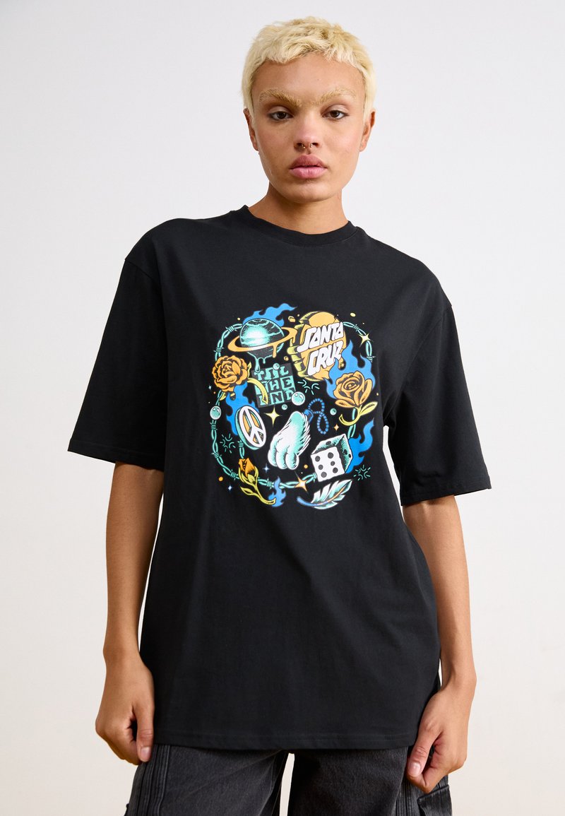 Black oversized t-shirt featuring a colorful graphic design with roses, dice, and various symbols. Made of soft cotton material.