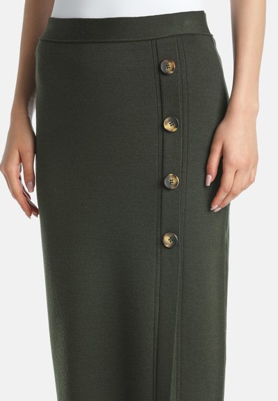 Olive green knit skirt with a high waist, featuring a side button closure with five brown buttons. Smooth texture and fitted shape.