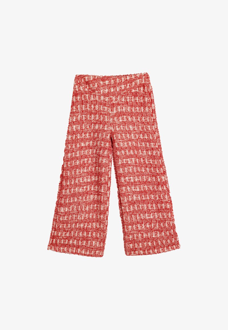 Rød- og hvidternet vidde bukser lavet af struktureret stof med elastisk talje, der viser en løs pasform og vævet mønster.