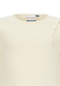 Top a coste color crema con scollatura rotonda e dettaglio a bottone sulla spalla. Realizzato in un tessuto morbido con una superficie liscia.