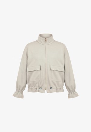 Világos bézs zipzáras dzseki magas gallérral, két elülső zsebfedővel, rugalmas mandzsettákkal és gombokkal szabályozható alsó szegéllyel.