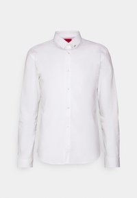 White long-sleeve button-up shirt, featuring a collar, front pocket, and shiny buttons, made from smooth cotton fabric.
