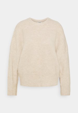 Beige knitted sweater with a relaxed fit, ribbed texture, round neckline, and long sleeves. Seam detailing at shoulders and hem.