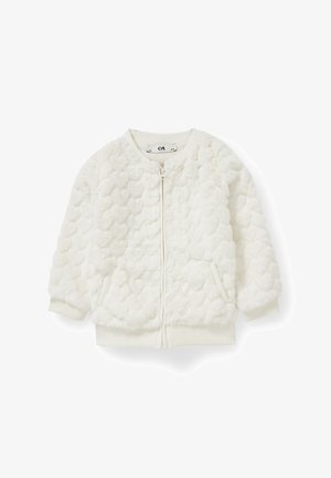 Veste blanche duveteuse zippée avec motif texturé en forme de cœur, col, poignets et bas côtelés, et deux poches avant.