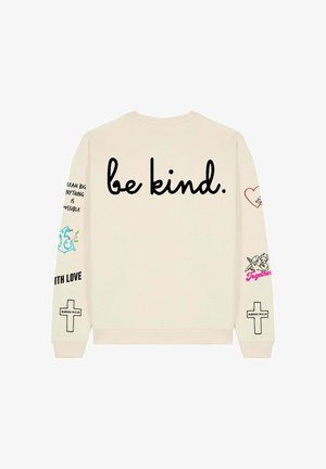 Felpa color crema con la scritta "be kind." in grande testo nero sulla schiena. Presenta grafiche e testo ricamati colorati sulle maniche.