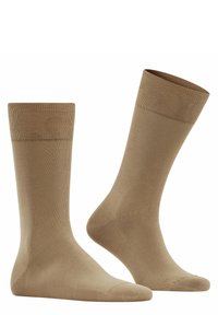 Beige cotton blend socks with a smooth texture, mid-calf length, and ribbed top. Designed for comfort and a secure fit.