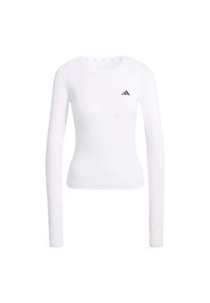 White long-sleeve athletic top with round neck, fitted design, and a small black Adidas logo on the left chest area. Smooth texture.