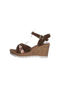 Brown suede wedge sandal with floral accent and adjustable strap. Cork platform with a white rubber sole; open toe design.