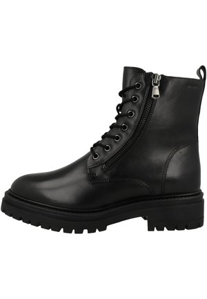 Black leather ankle boot with lace-up and side zipper closure, rugged textured outsole, and a chunky heel for stability.