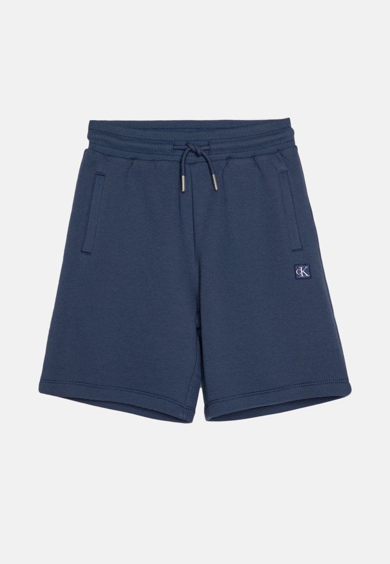 Mørkeblå bomullsshorts med elastisk liv, snor, to sidelommer og en liten logo på venstre foran.