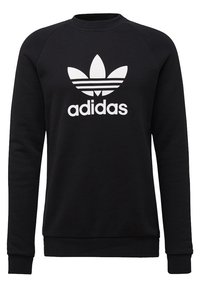 Black sweatshirt with long sleeves, round neck, and white Adidas logo featuring a trefoil design on the front. Cotton blend material.