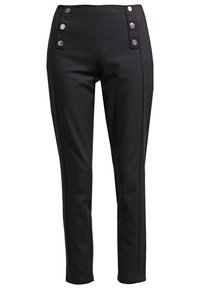 Pantalon noir ajusté taille haute, avec deux rangées verticales de boutons argentés près des poches avant.