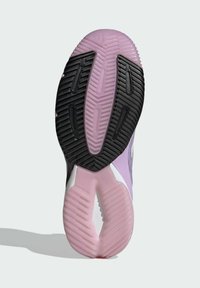 Purple sneaker sole features rubber traction with a black textured pattern, white accents, and a light pink midsole.
