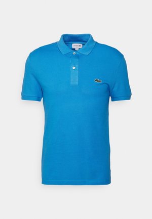 Blue polo shirt made of cotton, featuring a classic collar, short sleeves, and a small embroidered logo on the left chest.