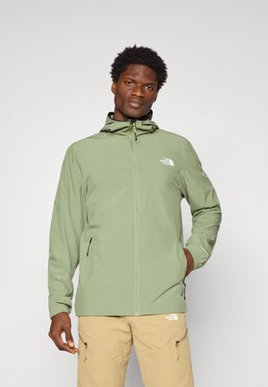 Veste zippée verte claire avec capuche, en tissu lisse, dotée d'un logo sur la poitrine, des poignets élastiques et de poches latérales zippées.