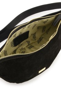 Black suede handbag with gold zipper, featuring a beige interior lined with a repeating brand logo pattern. Includes a small pocket.