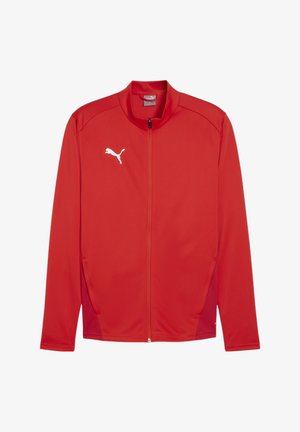 Rote Sportjacke aus leichtem Stoff. Verfügt über einen hohen Kragen, einen durchgehenden Reißverschluss und das weiße Puma-Logo auf der linken Brust. Seitentaschen sind enthalten.