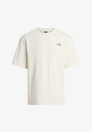 Jednoduché krémově bílé tričko s krátkým rukávem a malým světle hnědým logem The North Face na levé horní straně hrudi.