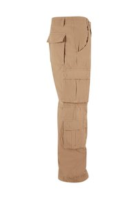 Beige cargo pants with multiple side pockets, elastic waistband, and a relaxed fit. Made from lightweight fabric, they have a smooth texture.