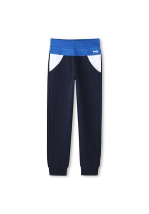 Pantalons de survêtement navy avec une ceinture bleue, des accents blancs sur les poches et des poignets côtelés. Tissu doux ; design décontracté adapté à diverses activités.