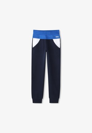 Pantalons de survêtement navy avec une ceinture bleue, des accents blancs sur les poches et des poignets côtelés. Tissu doux ; design décontracté adapté à diverses activités.