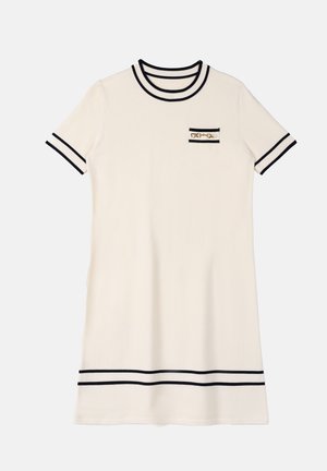 Cream short-sleeve knit dress with black trim on collar, sleeves, hem, and a small chest pocket featuring gold chain detail.