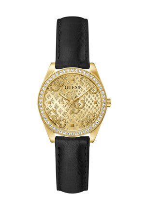 Gold Guess wristwatch with crystal-studded bezel, patterned gold dial, three hands, and black leather strap.
