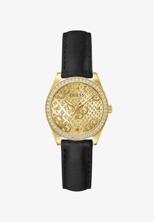 Arany Guess karóra, melynek kristályokkal díszített kerete, mintás arany számlapja, három mutatója és fekete bőrszíja van.