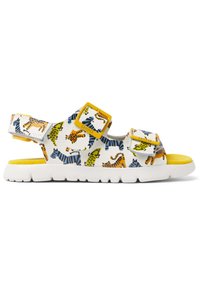 White sandal featuring a colorful animal print in yellow, green, and blue, with two adjustable yellow buckles and a white sole.