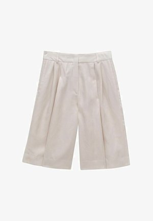 Beżowe, plisowane culottes wykonane z lekkiego materiału, z wysokim stanem i szerokimi nogawkami, o gładkiej teksturze i bez widocznych wzorów.