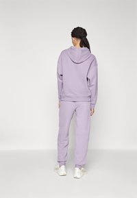 Puma LOUNGEWEAR TRACKSUIT SET - Tracksuit - pale plum