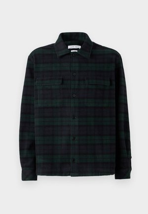 Grøn og sort ternet flannel-skjorte, lange ærmer, knaplukning foran, to brystlommer og kravedetalje. Blød tekstur, almindelig pasform.